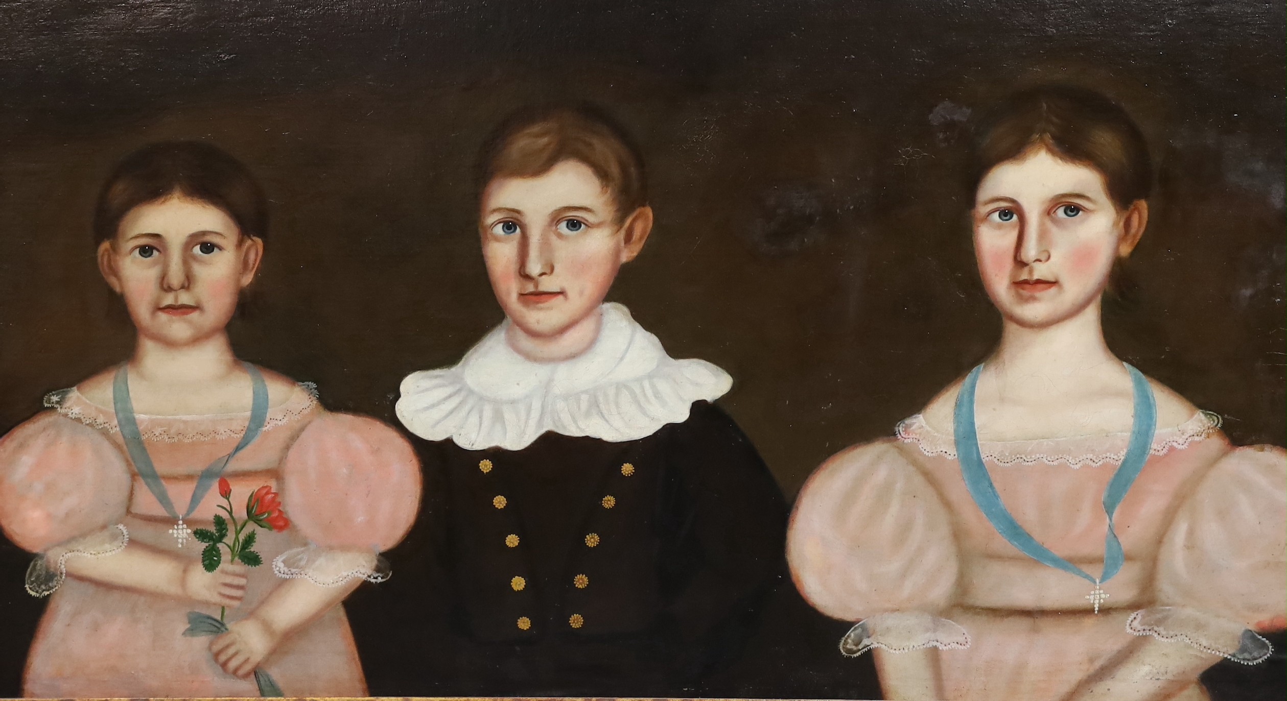 American Primitive School , Portrait of three children of the Burgess family, oil on canvas laid on board, 60 x 107cm